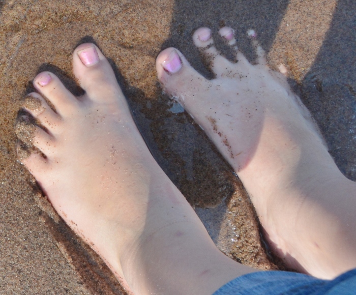 madi's feet in sand